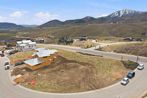 Aerial view of residential area featuring a mountain backdrop