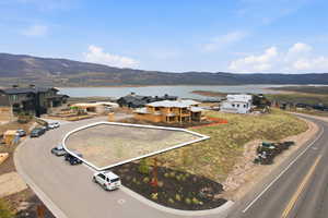 Aerial view of residential area featuring a mountain backdrop