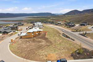 Aerial perspective of suburban area featuring a water and mountain view