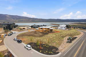 Aerial perspective of suburban area with a mountainous background