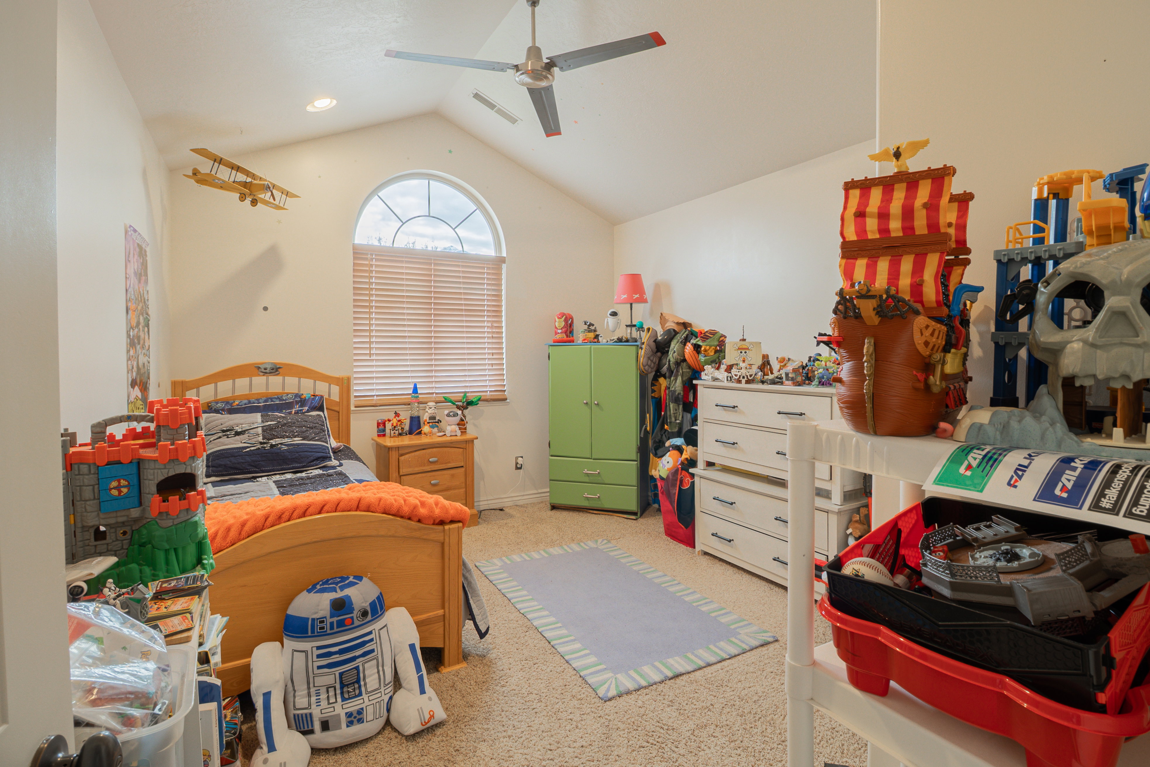 Bedroom featuring light colored carpet and ceiling fan