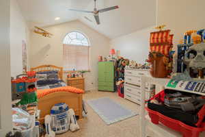 Bedroom featuring light colored carpet and ceiling fan