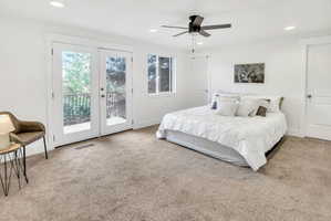 Spacious room featuring light brown carpet flooring and white walls