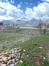 View of mountain backdrop with rural landscape
