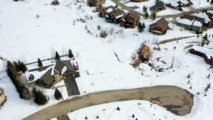 Snowy aerial view featuring a residential view