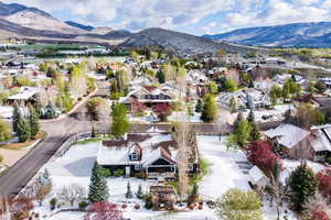 Aerial perspective of suburban area with a mountain backdrop