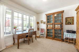 Home office featuring baseboards and a textured ceiling