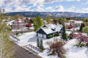Aerial perspective of suburban area with a mountainous background