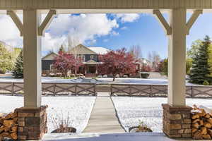 Fenced front yard with covered porch