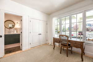 Office space with a sink and a textured ceiling
