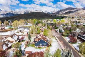 Aerial perspective of suburban area with a mountain backdrop