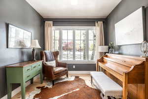 Sitting room featuring wood finished floors and a textured ceiling