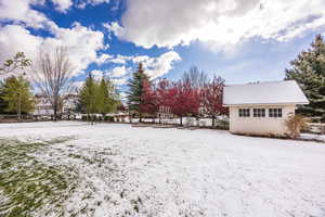 View of yard covered in snow