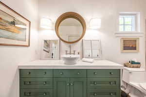 Bathroom featuring vanity and toilet