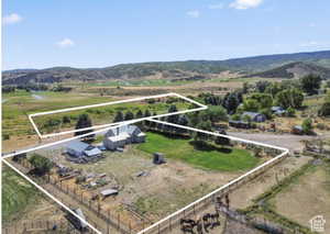 Aerial view of sparsely populated area with mountains and property boundaries highlighted
