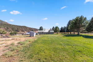 View of yard featuring a view of countryside and a mountain view