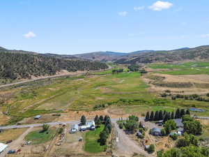 Overview of rural landscape featuring a mountain backdrop
