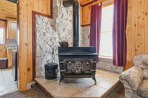 Detailed view of a wood stove and wood walls