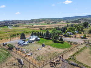 Aerial view of sparsely populated area featuring a mountain backdrop