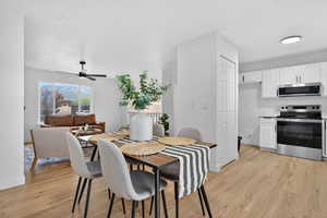 Dining space featuring light wood-type flooring and ceiling fan