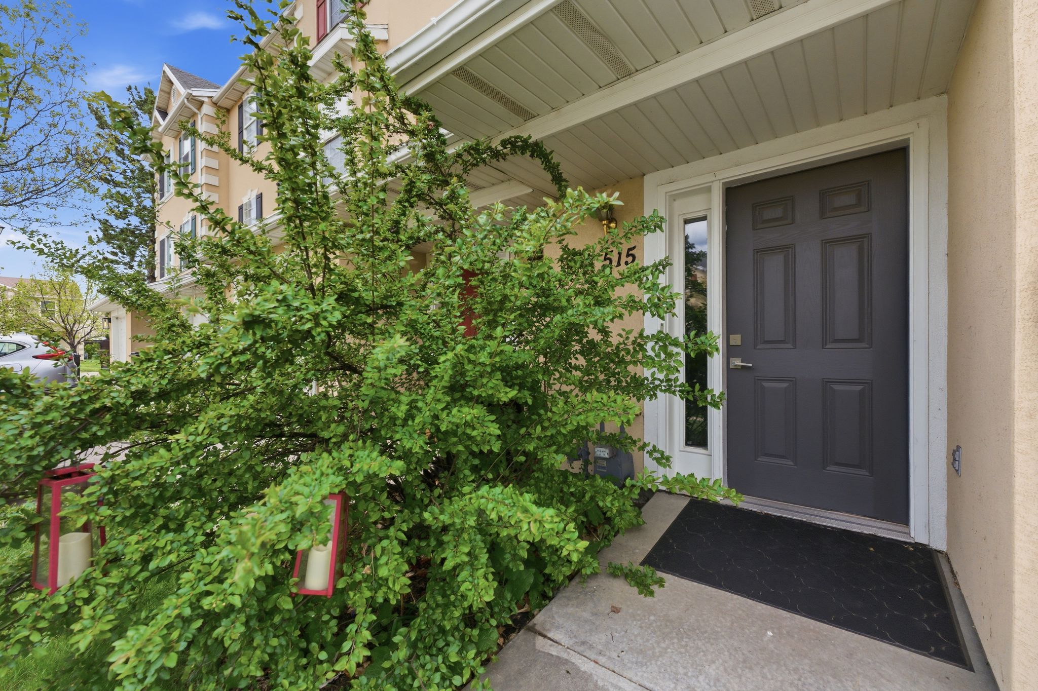 Doorway to property featuring stucco siding