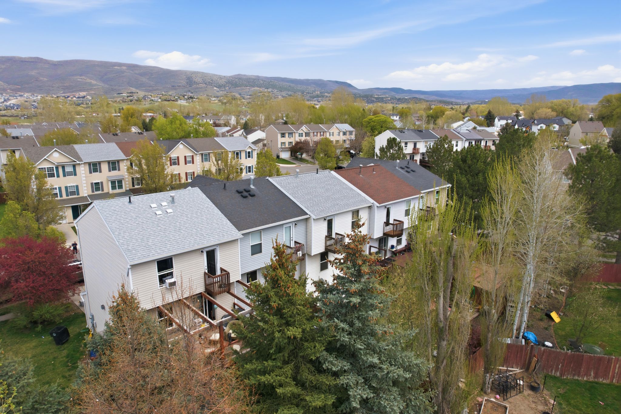 Aerial view of residential area featuring mountains