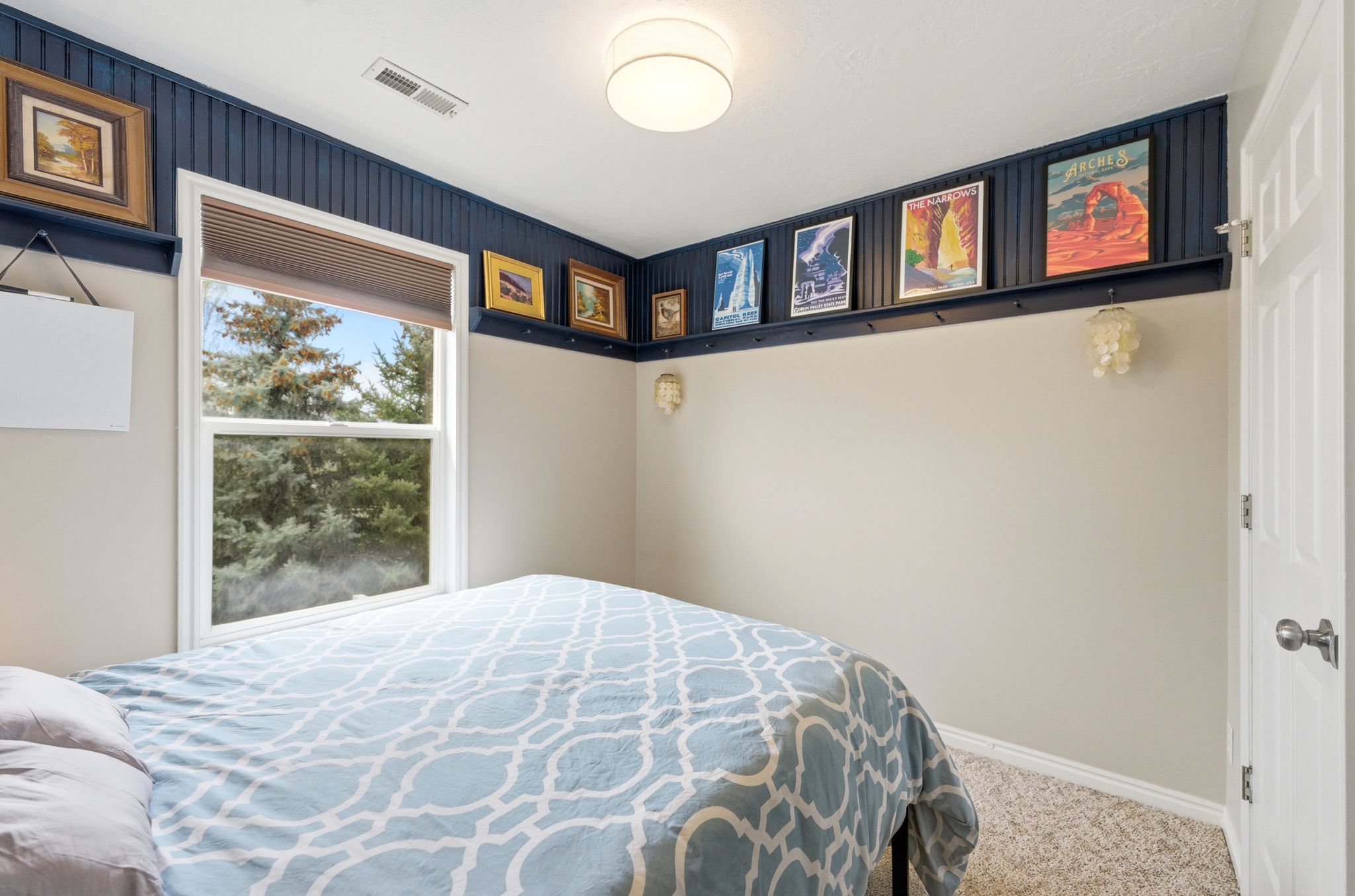 Bedroom featuring carpet flooring and baseboards