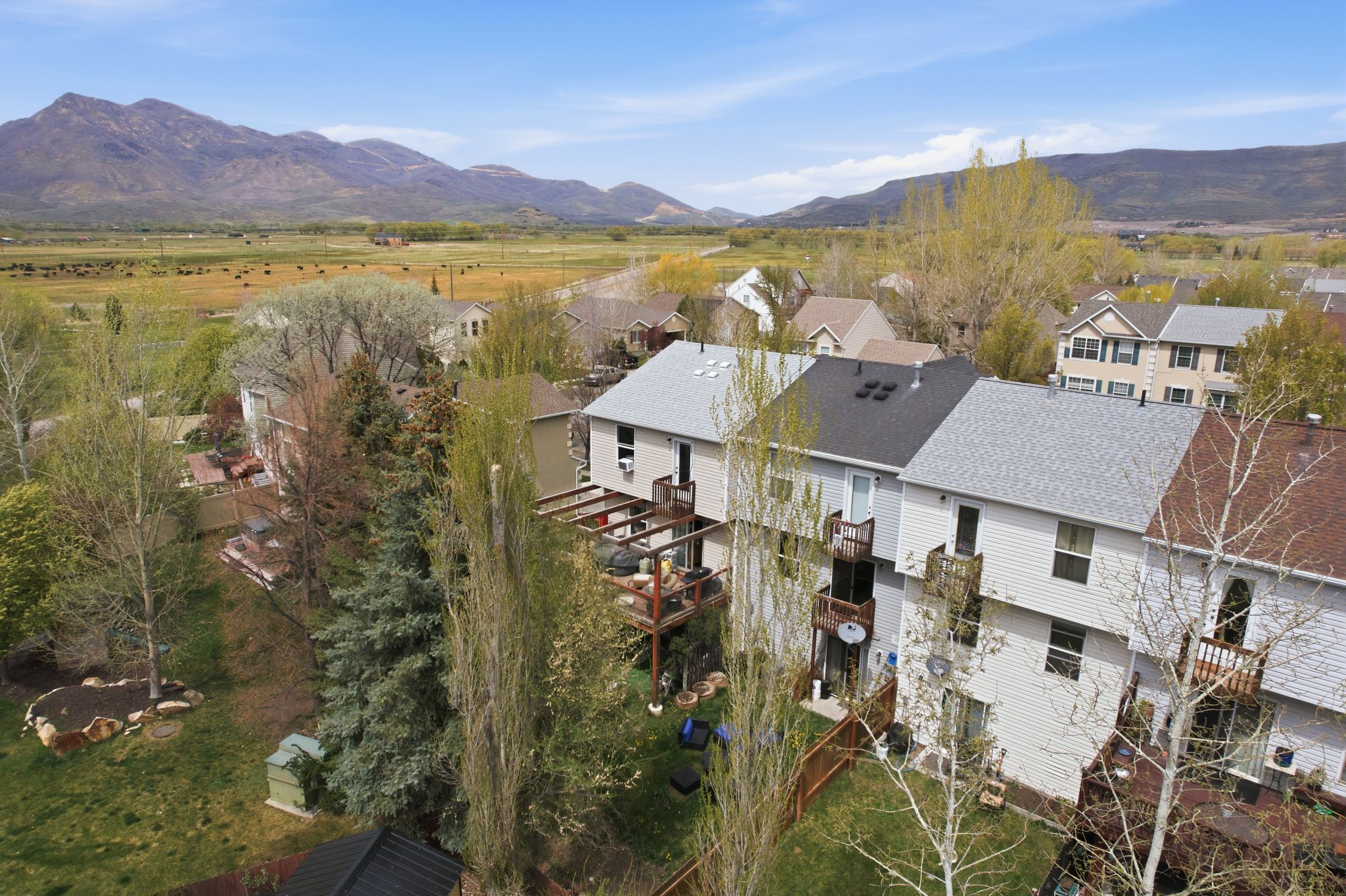 Aerial view of residential area featuring a mountain backdrop
