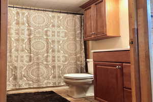 Full bathroom with a shower with shower curtain and vanity
