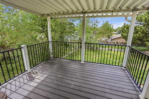 Wooden deck featuring a yard