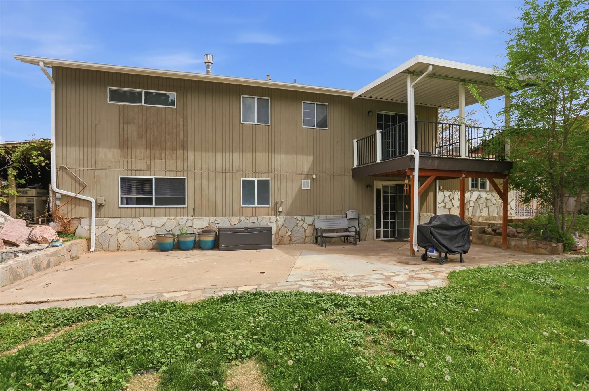 Back of property with a patio area.