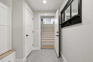 Entryway with stairway and recessed lighting