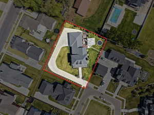 Aerial perspective of suburban area with property parcel outlined