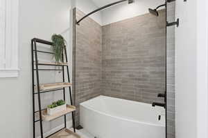 Full bath featuring shower / tub combination