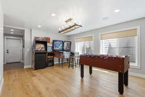 Recreation room featuring light wood finished floors and recessed lighting