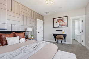 Carpeted bedroom with baseboards