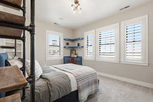 Bedroom with carpet and baseboards