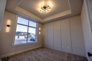 Den/office area with large windows and light fixtures