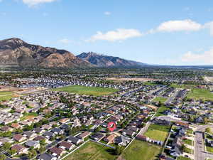 Aerial view of residential area featuring a mountainous background