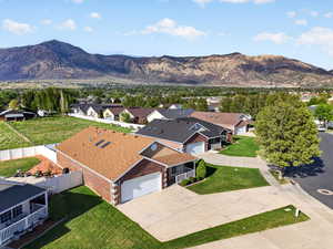 Aerial perspective of suburban area featuring a mountainous background