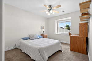 Bedroom with carpet flooring and ceiling fan