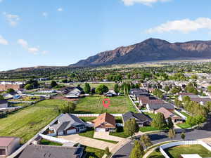 Aerial perspective of suburban area featuring a mountainous background