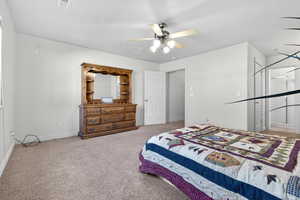 Bedroom featuring ceiling fan and light carpet