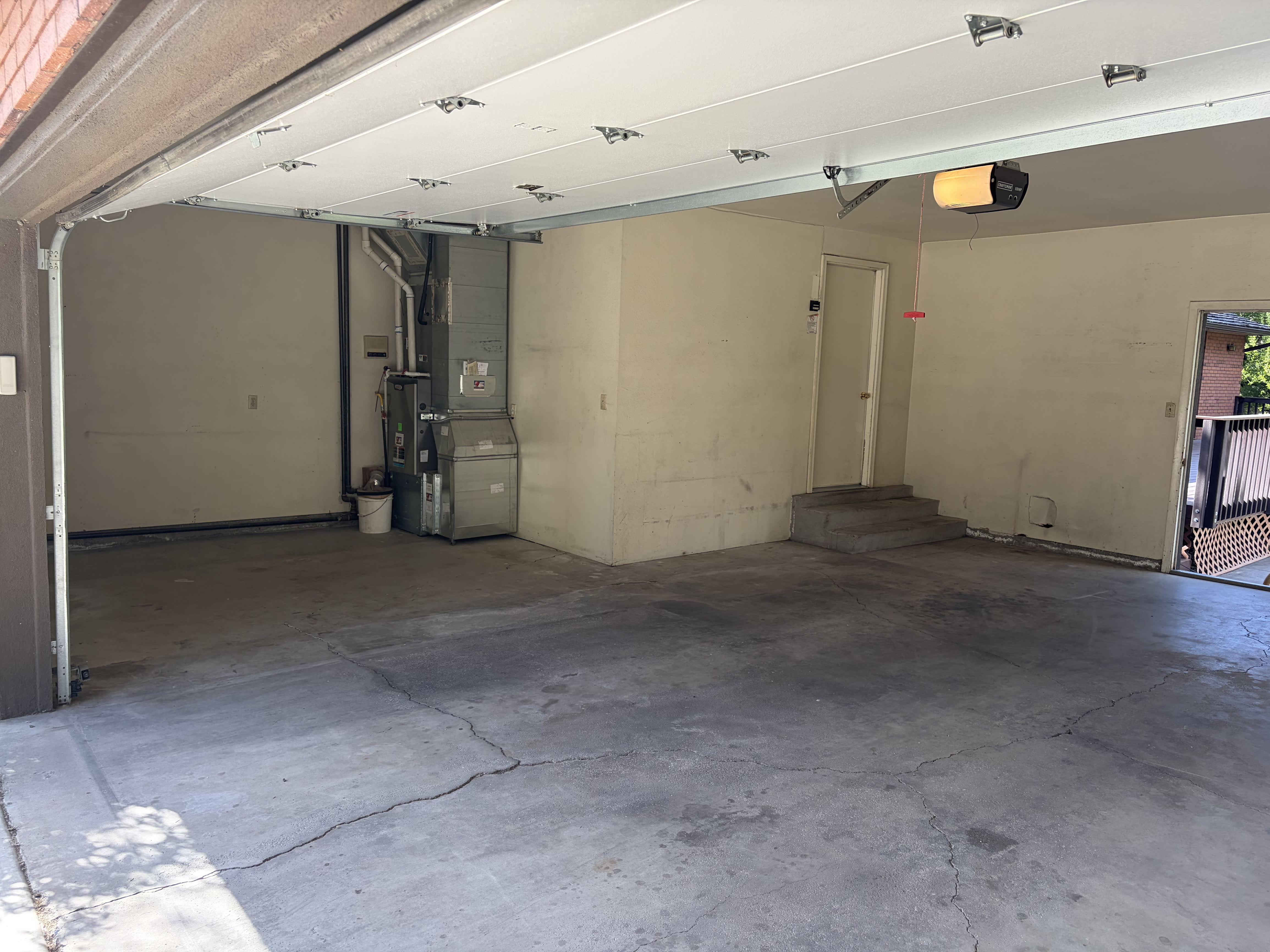 Garage with heating unit and a garage door opener