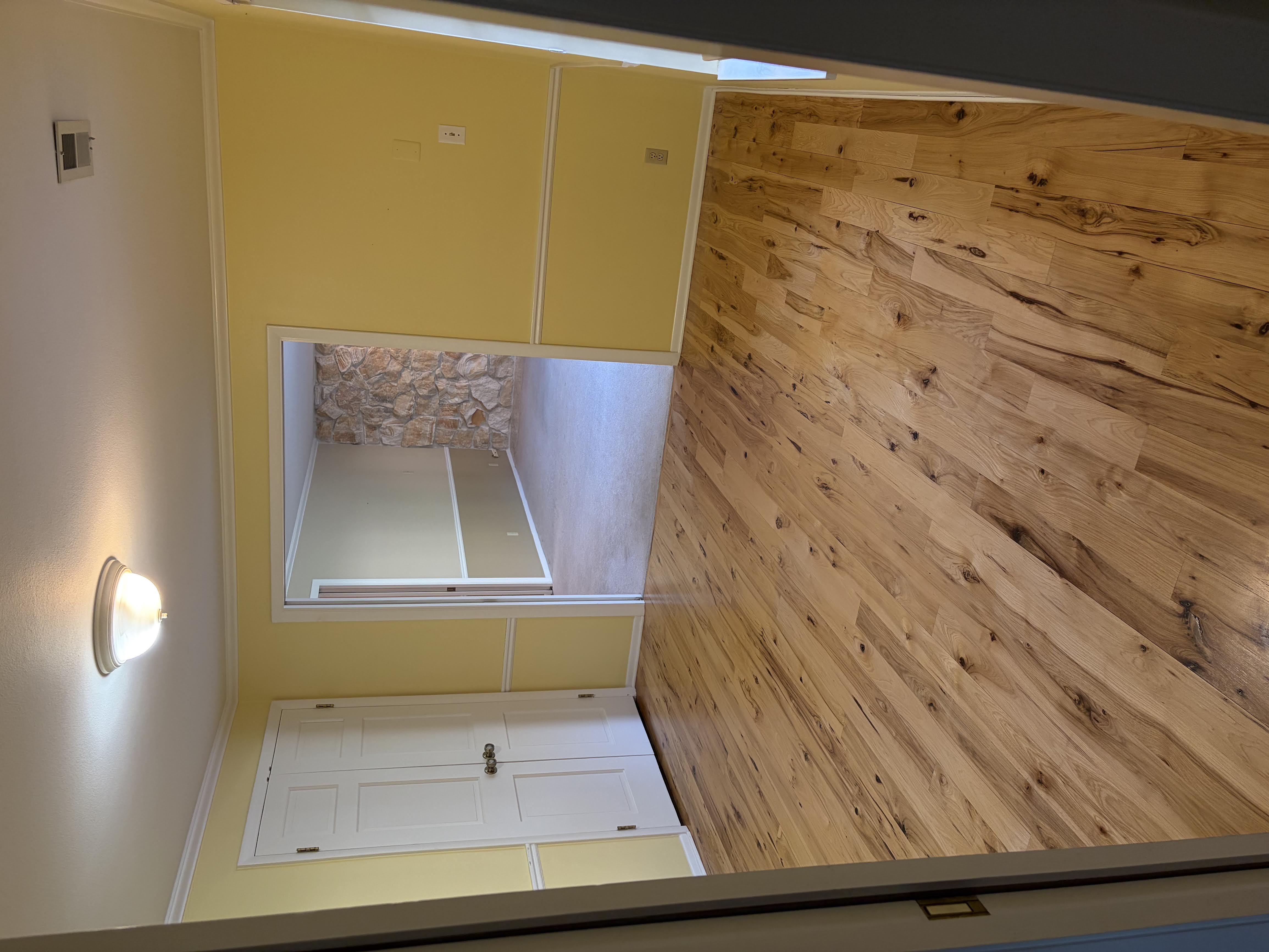 Unfurnished room with light wood-type flooring and crown molding