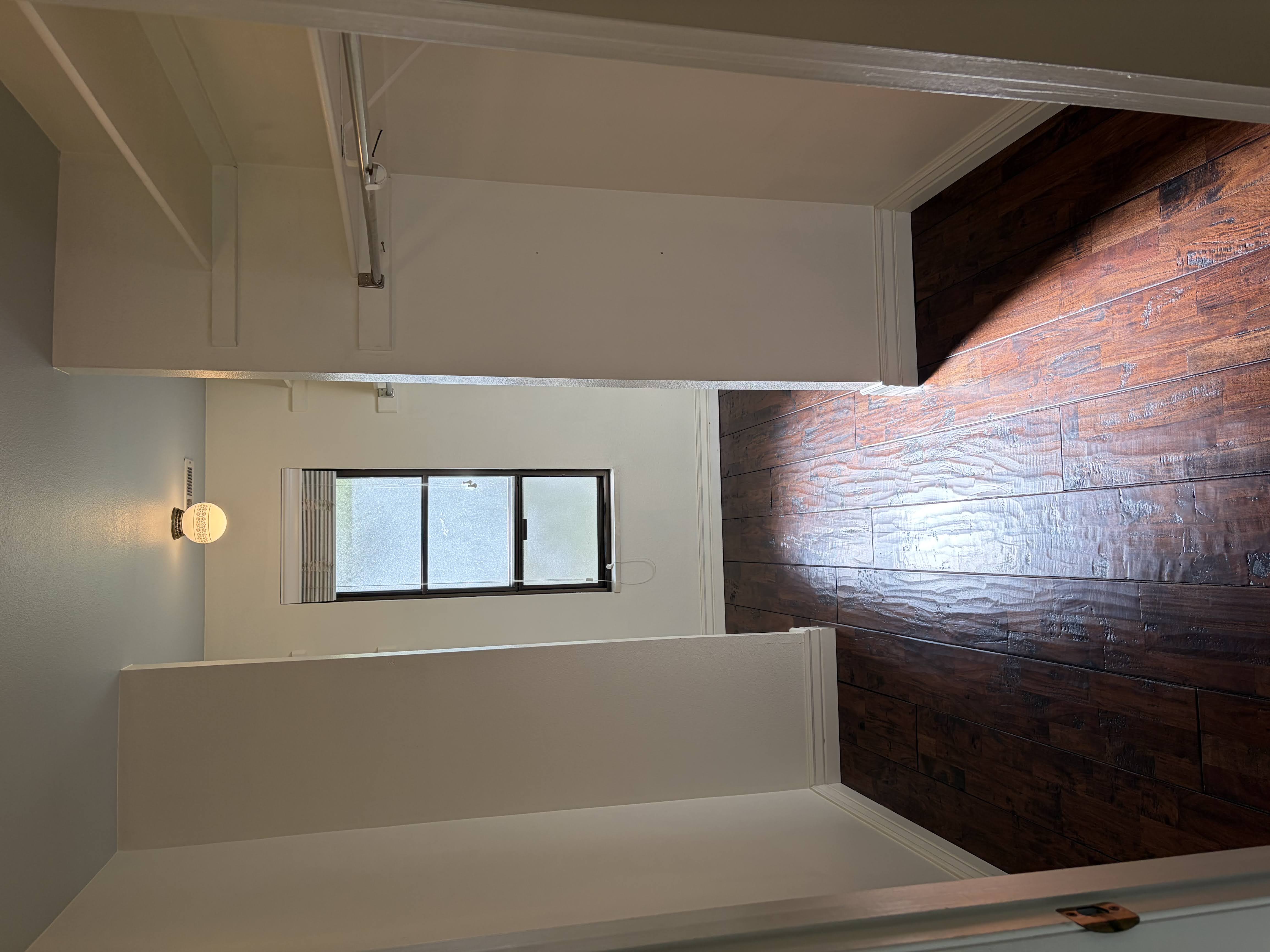 Walk in closet featuring dark wood finished floors