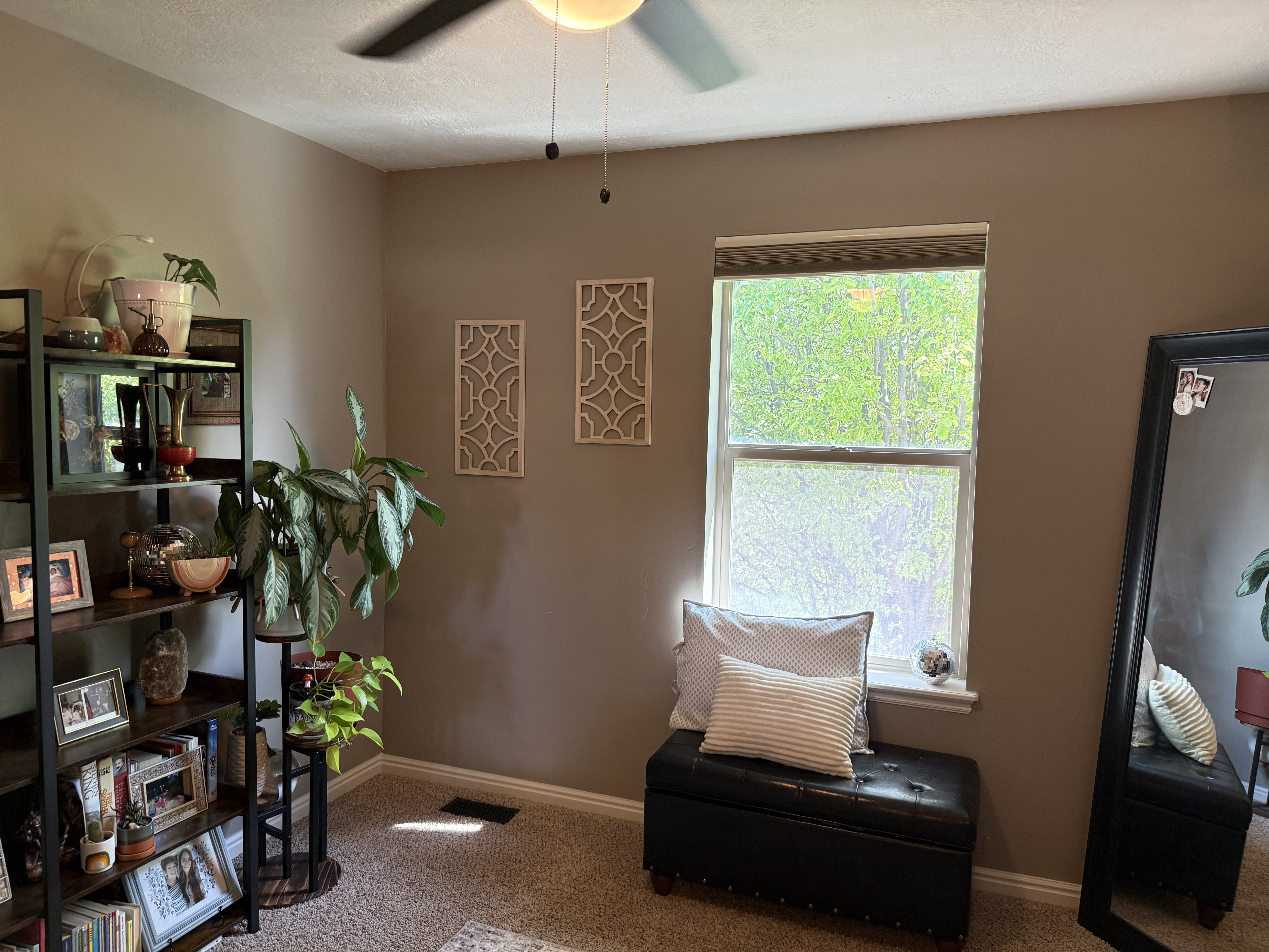 Bedroom with light colored carpet and ceiling fan