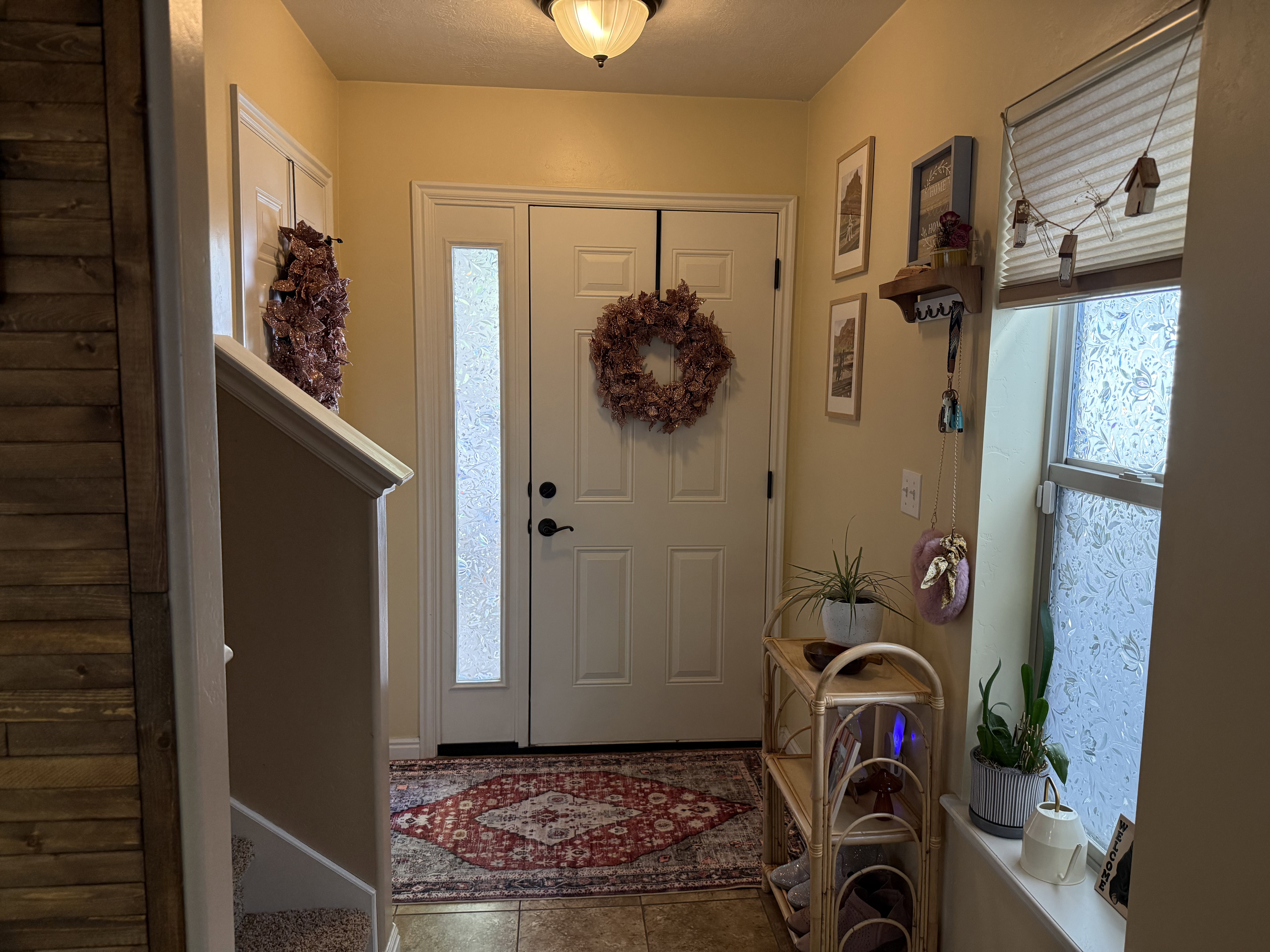 Foyer entrance featuring light tile patterned floors