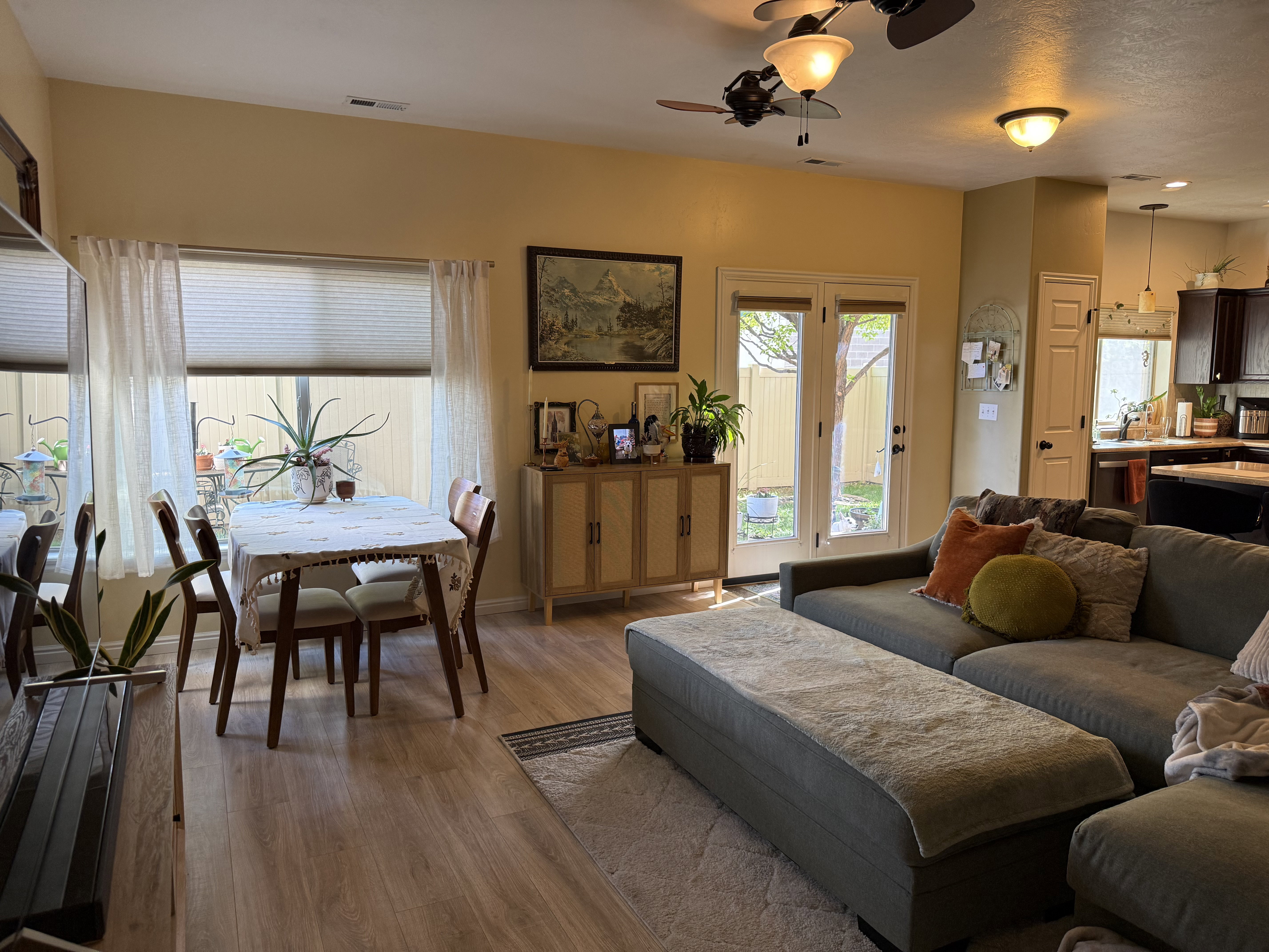 Living room featuring ceiling fan and wood finished floors