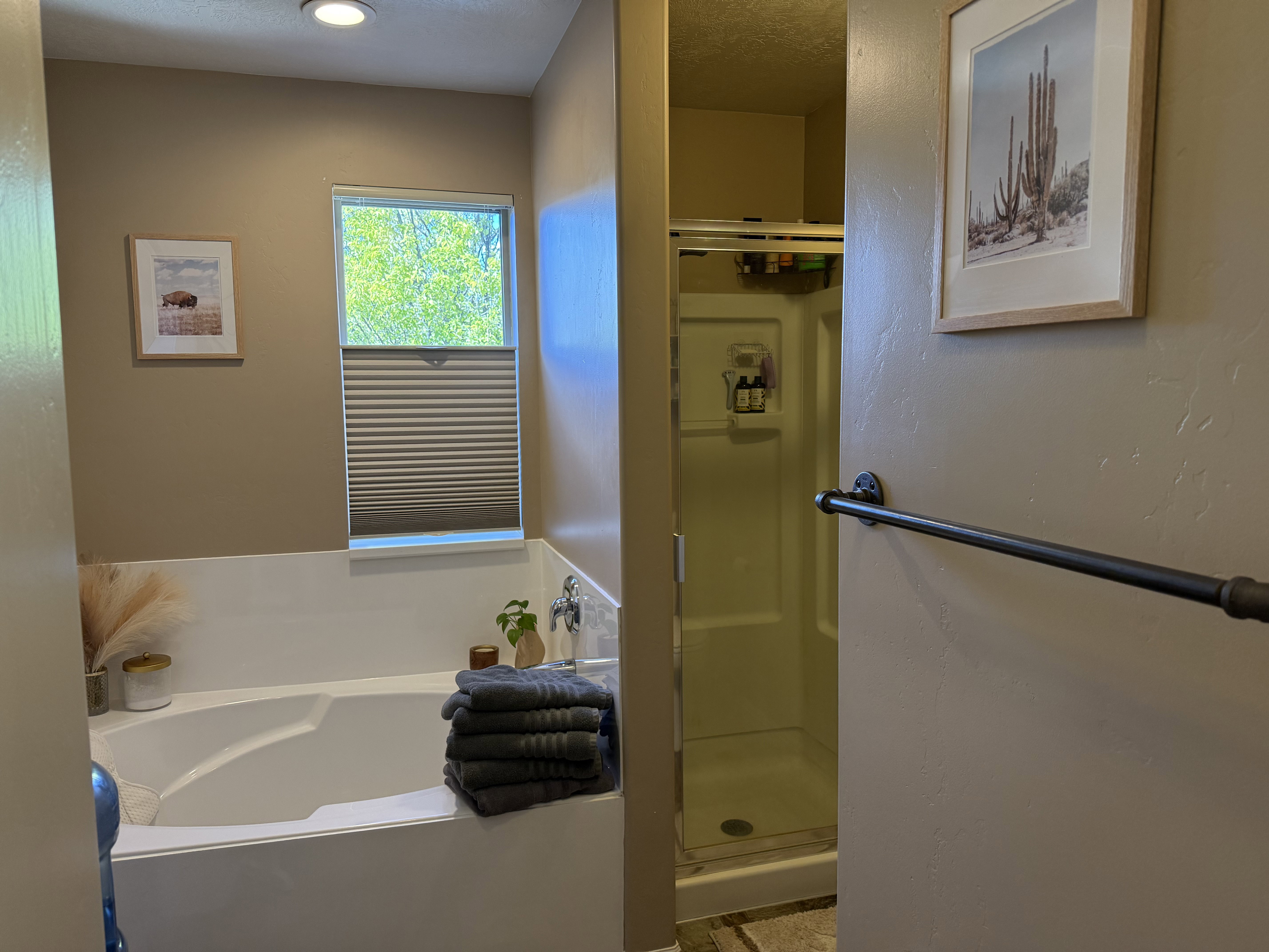 Full bathroom with a stall shower and a garden tub